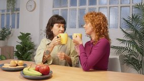 Celebrating diversity: two women enjoying morning coffee together - Powered by Shutterstock - Get 15% off with code: PIKWIZARD15