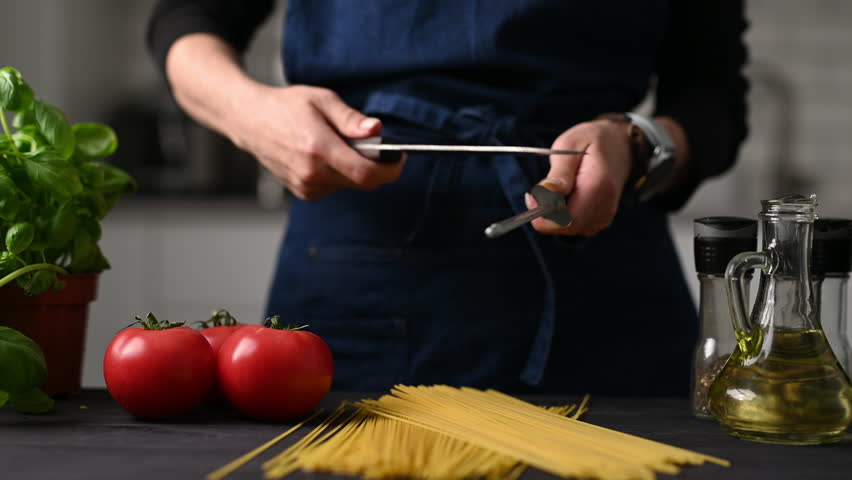 Girl Leader Sharpening A Knife Using A Sharpening Rod Tool