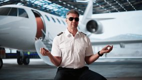 Air Plane Pilot Officer Doing Yoga Meditation Exercise And Praying - Powered by Shutterstock - Get 15% off with code: PIKWIZARD15