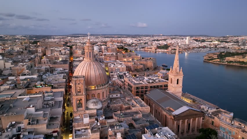 Aerial view of Beautiful sunset over Valletta with historic architecture and coastal view of Malta in the distance