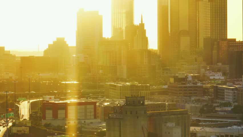 Cinematic view of the sunset Downtown Dallas Skyline.