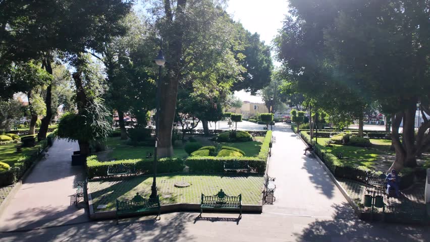 Explore the vibrant Plaza de la Concordia in Cholula Puebla with its beautiful garden and fountain