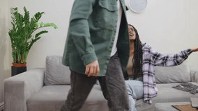 An African-American couple argues on the couch at home. The tension is palpable as they exchange heated words in their living room - Powered by Shutterstock - Get 15% off with code: PIKWIZARD15