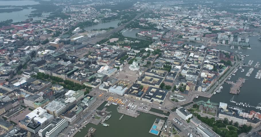 Helsinki Downtown Cityscape, Finland. Cathedral Square, Market Square, Sky Wheel, Port, Harbor in Background. Drone Point of View