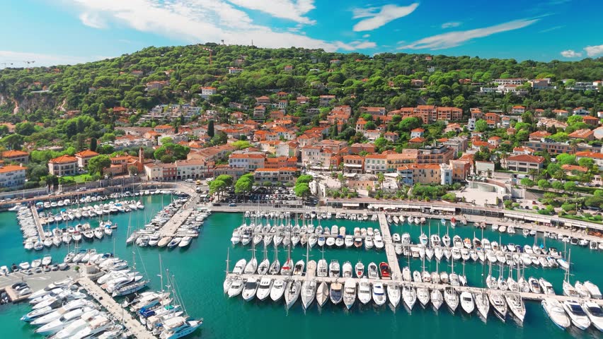 Aerial view of the Saint-Jean-Cap-Ferrat resort town on Cap Ferrat cape at French Riviera of Mediterranean Sea. Harbour of Saint Jean Cap Ferrat, France. Luxury travel destination in Cote dAzur
