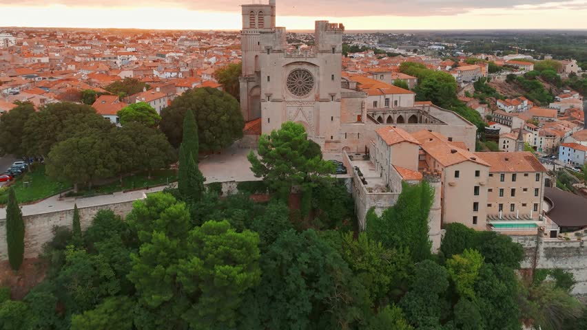 Magnificent Cathedral of Saint Nazaire in Beziers at sunrise, Southern France. Aerial view of the Beziers old town in France.