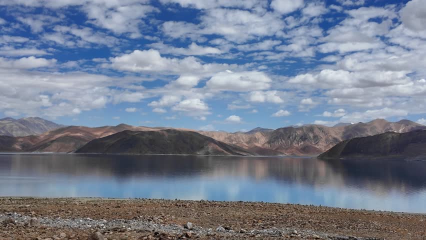 Pov of Leh Ladakh by road, landscapes of rugged mountains, high altitude deserts and serene lakes