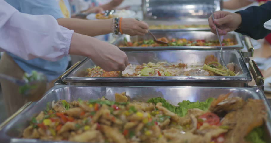 People hand grab buffet asain food in seminar hotel room food and drink concept