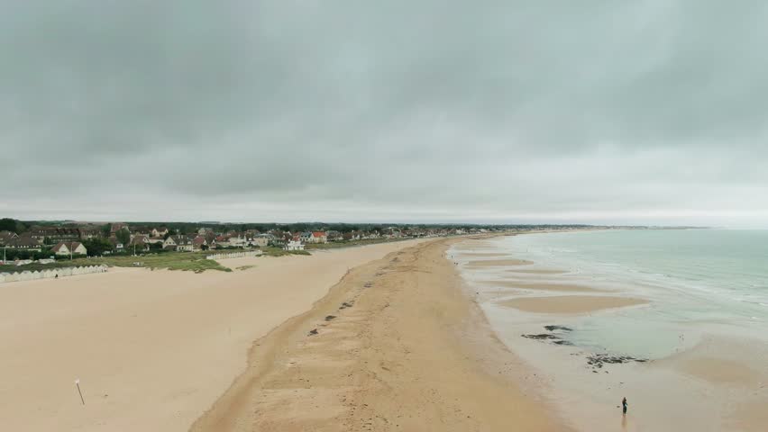Beach Under A Cloudy Sky.