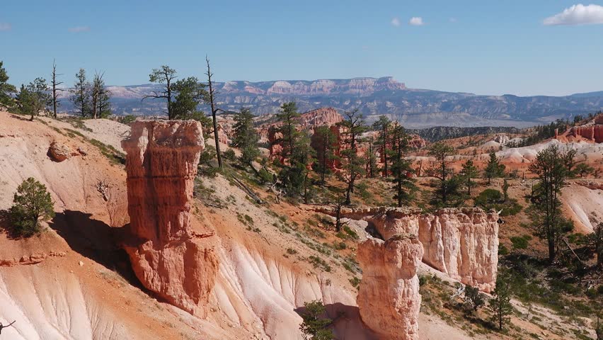 Stunning views overlook the unique rock formations and vibrant colors of the Bryce Canyon landscape at sunset in Utah