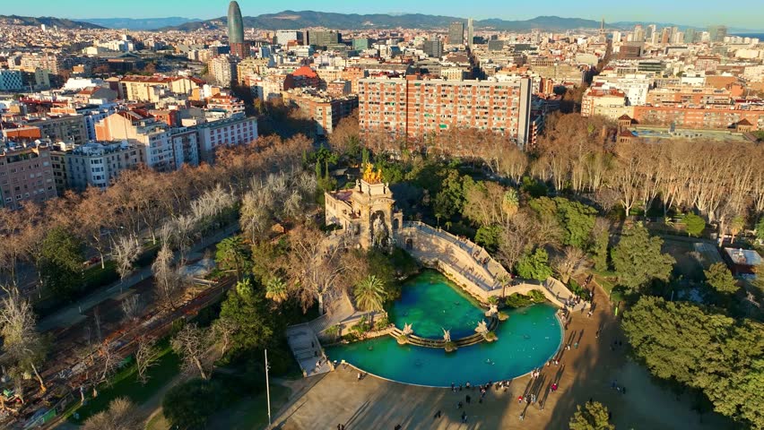 Barcelona city aerial view with Parc de la Ciutadella at sunset, drone view of Barcelona downtown, tourism in Barcelona, Spain