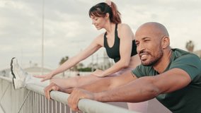Side view of multi-ethnic couple of fit people training together in summer on the seafront. Couple goals and sports motivation, active lifestyle. Teamwork in sport - Powered by Shutterstock - Get 15% off with code: PIKWIZARD15