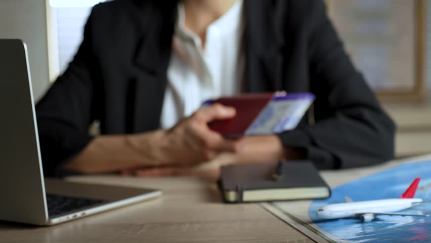Travel agent giving passports and tickets to man close up. Person buying flight tickets in travel agency for summer vacation