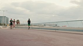 Multi-ethnic couple training together in summer on the seafront. Street work out concept, couple goals and motivation. Happy fit people are cheerfully doing sports - Powered by Shutterstock - Get 15% off with code: PIKWIZARD15