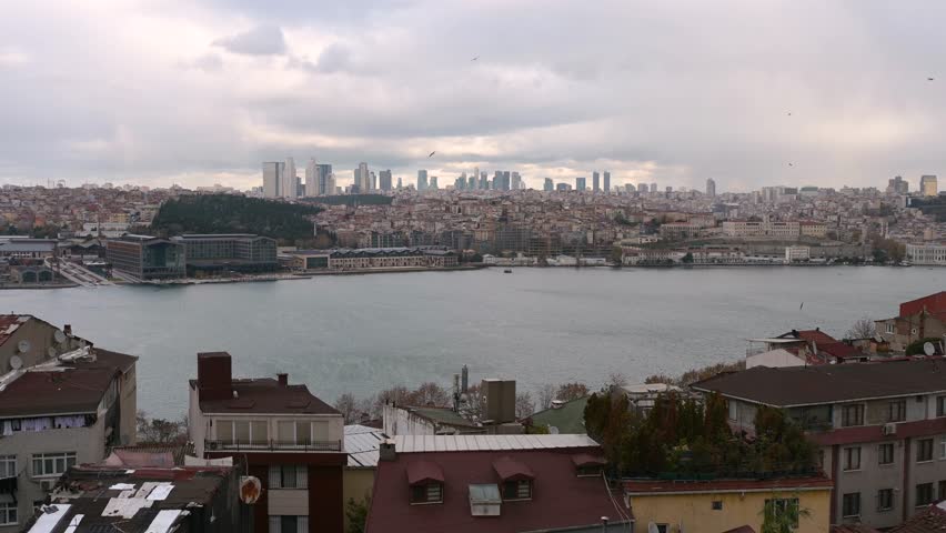 Panorama view of Istanbul from the Fatih district near the Yavuz Sultan Selim Mosque, Turkey. Golden horn, clouds, ferries and roofs