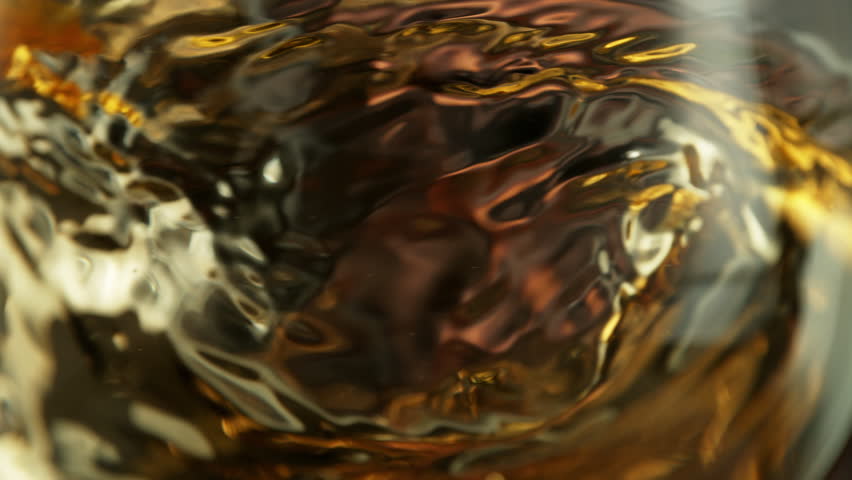 Super Slow Motion Macro Shot of Spinning White Wine in Glass at 1000fps.
