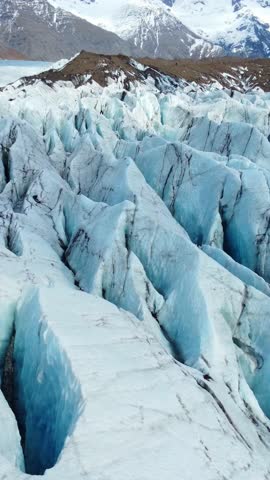 Vertical Screen: Vatnajokull Glacier in Iceland. Pure blue ice, winter landscape aerial view 4k. Largest glacier in Europe. Popular tourist attraction, melting glacier. Shot for Social Media