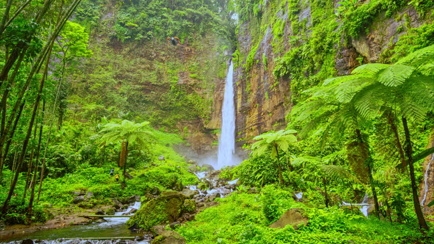Time lapse beautiful waterfall in Indonesia some of waterfall has speciality to impress the visitor. there is an amazing waterfall that worth to visit. Coban Sriti twin Waterfall is beautiful
