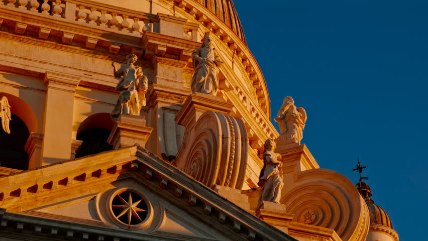 Revealing the imposing Basilica Santa Maria della Salute with its impressive dome during sunset in Venice, Italy. Venice is an archipelago of 126 islands linked by 472 bridges
