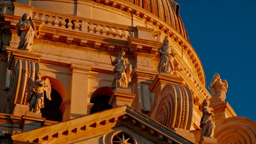 Revealing the imposing Basilica Santa Maria della Salute with its impressive dome during sunset in Venice, Italy. Venice is an archipelago of 126 islands linked by 472 bridges
