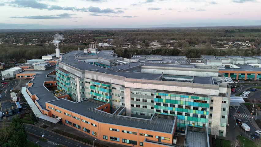 Peterborough city hospital UK pull back drone aerial reverse reveal