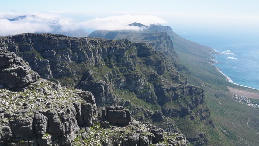 Cape Town, South Africa - November 23, 2024 Rocky terrain above the clouds with Peninsula views at the summit of Table Mountain in Cape Town South Africa