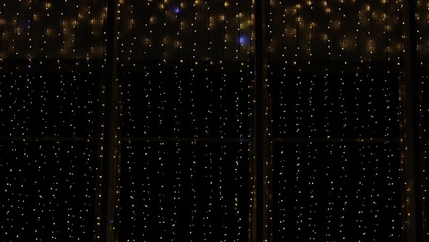 Shimmering lights adorn the evening at a festive display in the city
