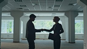 Corporate colleagues walking office building in suits. Confident couple discussing work. Relaxed man woman talking strolling construction site together. Two people enjoying communication lunch break - Powered by Shutterstock - Get 15% off with code: PIKWIZARD15