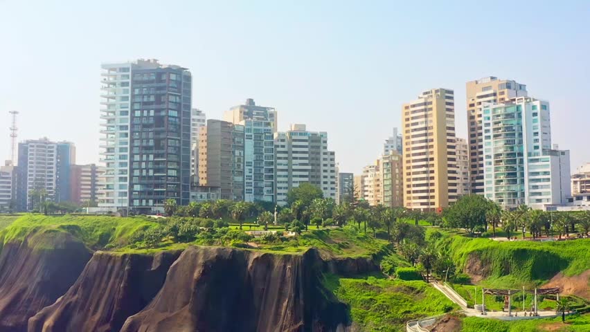 Modern beachfront buildings in Miraflores, Lima, Peru, with scenic coastal cliffs