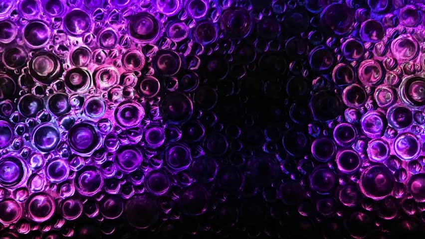 Circles motion wallpaperin purple, pink and black tones .Zoom and distort wallpaper. Textured wall with movement of light.Flashes of light on textured glass black background.Glass texture of circles 