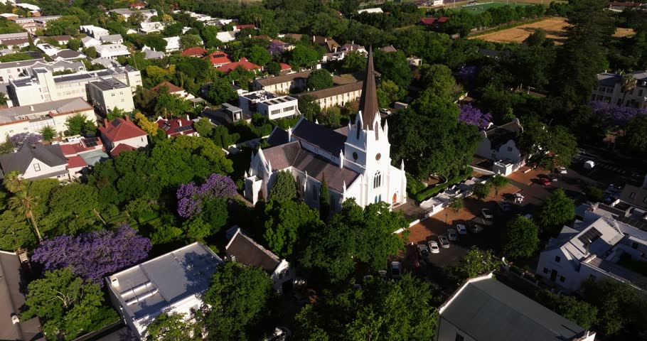 Drone Orbits Above Quaint White Church in Downtown Stellenbosch, South Africa