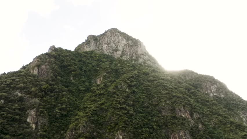 Soufriere Saint Lucia drone shot of the peak of the Petit Piton with the sun peaking over the mountain