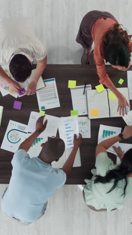 People, meeting and planning with documents, graphs or collaboration with b2b agreement at marketing agency. Men, women and above with teamwork, review and paperwork with charts at startup company