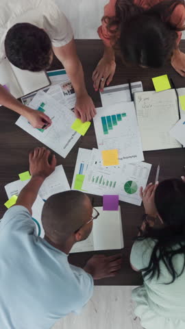 People, meeting and planning with paperwork, graphs and collaboration with feedback at marketing agency. Men, women and above with teamwork, strategy and documents with project at startup company