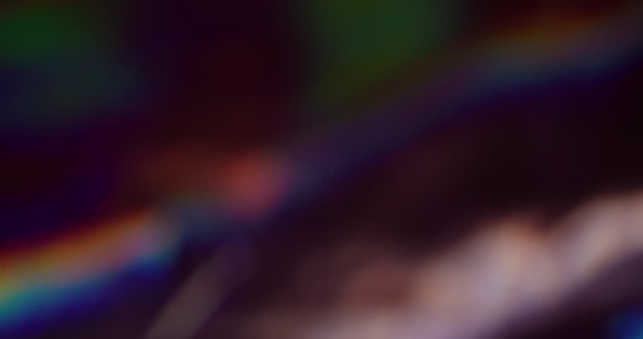 Defocused multicolored flashes. Rainbow pulsation. Soft transitions light. Abstract twist ray light line. Darkening highlighting with blur. Creative animated background.