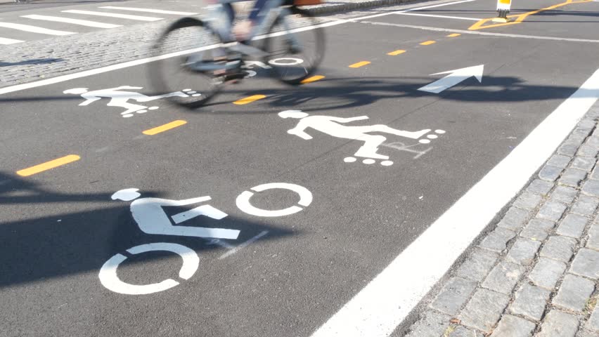 Bike lane asphalt sign, New York City. Bicycle path, cycle route for bicyclists, Manhattan. Way for roller skating and skates. Recreational sport activity infrastructure, biker cycling, United States.