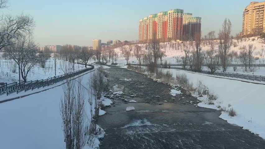Mountain river on the background of residential buildings.