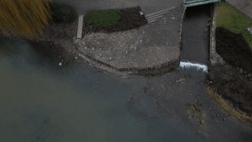 newly created natural embankment by river. benches, terraces, relaxed staircase serve people as well as fishing and relaxation. strengthening banks against water erosion by large stones on dry lined - Powered by Shutterstock - Get 15% off with code: PIKWIZARD15