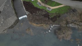 newly created natural embankment by river. benches, terraces, relaxed staircase serve people as well as fishing and relaxation. strengthening banks against water erosion by large stones on dry lined - Powered by Shutterstock - Get 15% off with code: PIKWIZARD15