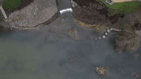 newly created natural embankment by river. benches, terraces, relaxed staircase serve people as well as fishing and relaxation. strengthening banks against water erosion by large stones on dry lined - Powered by Shutterstock - Get 15% off with code: PIKWIZARD15