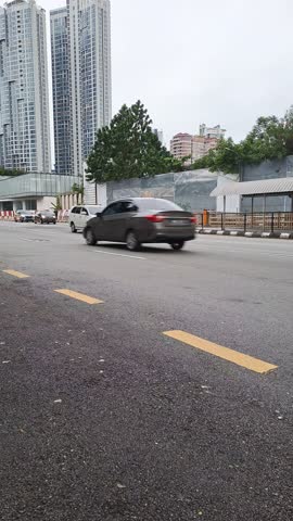 Kuala lumpur, Malaysia - January 9, 2025  : View of city streets, urban traffic and buildings in the morning in Kuala Lumpur, Malaysia