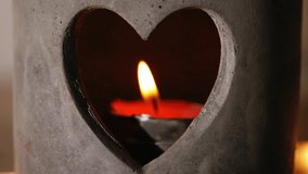 Heart shape romantic candle holder close up 4k shot selective focus - Powered by Shutterstock - Get 15% off with code: PIKWIZARD15