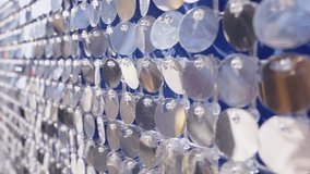 Light reflecting on many silver sequins attached to blue fabric creates a glamorous and celebratory atmosphere, perfect for fashion, entertainment, or party-themed projects - Powered by Shutterstock - Get 15% off with code: PIKWIZARD15