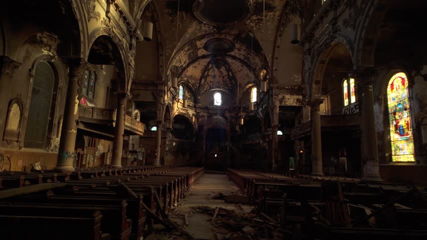 Broken Pew Chairs Inside The Abandoned Church Of Saint Eusebe de Verceil Due To Fire In Montreal, Canada. - handheld shot