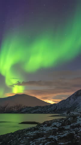 Tromso Norway time lapse of the aurora borealis northern lights winter landscape at Rorvikneset Sommaroy (Vertical)