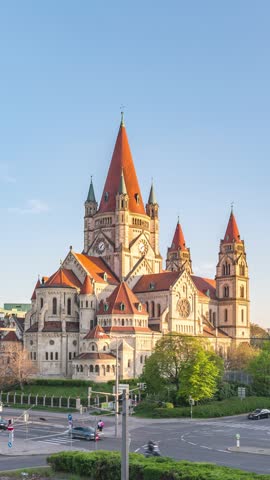 Vienna Austria time lapse city skyline at St. Francis of Assisi Church (Vertical)