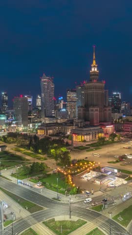 Warsaw Poland time lapse high angle view night to day city skyline at Centrum Square downtown business district (Vertical)