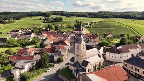 Aerial landscape view of a traditional french village and vineyard rows in the Champagne region, France, on a sunny evening - Powered by Shutterstock - Get 15% off with code: PIKWIZARD15