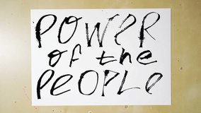 Handwriting transformation empowering message power of the people on paper with dynamic brush strokes. - Powered by Shutterstock - Get 15% off with code: PIKWIZARD15