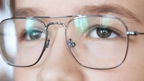 Close up portrait of a cute teenager in the eyeglasses. Care of eyes. Child looking to camera in the glasses. Medical, eyes health and school concept - Powered by Shutterstock - Get 15% off with code: PIKWIZARD15